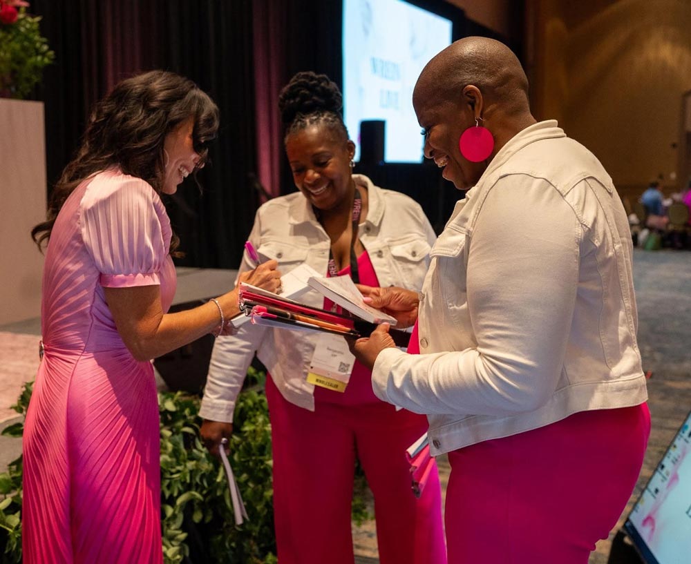Empowered woman over 50 reviewing real estate investing portfolio for retirement freedom